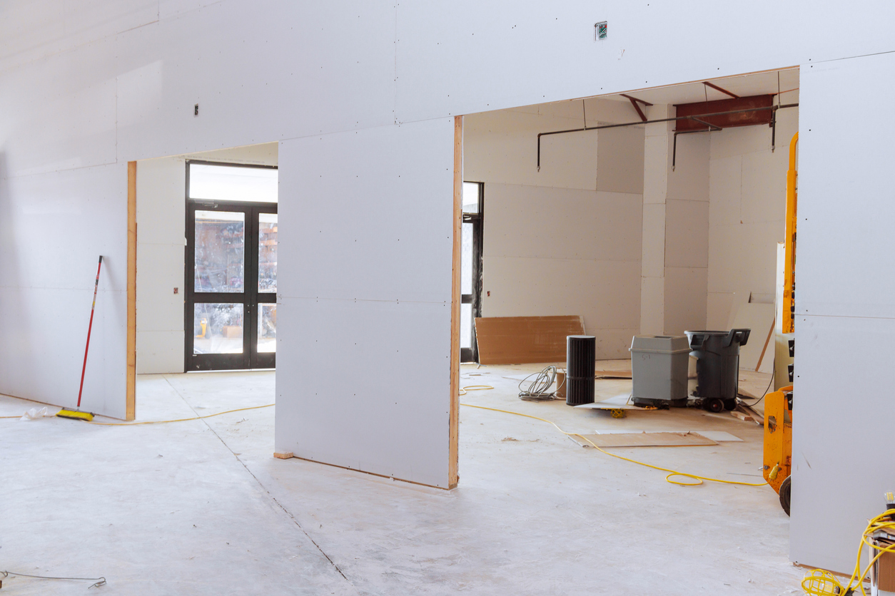 Drywall installation in progress inside a commercial property