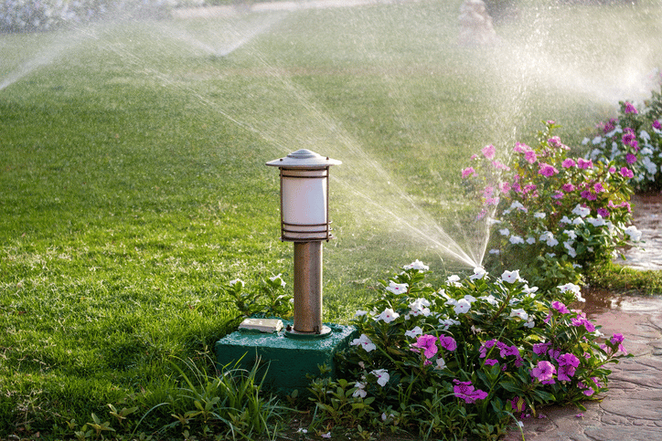 commercial landscaping sprinkler and pathway light
